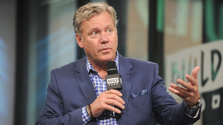 Chris Hansen holding microphone