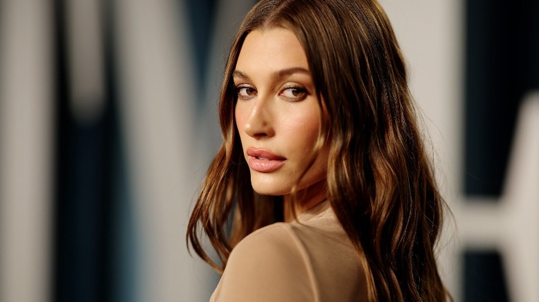 Hailey Bieber looking over her shoulder