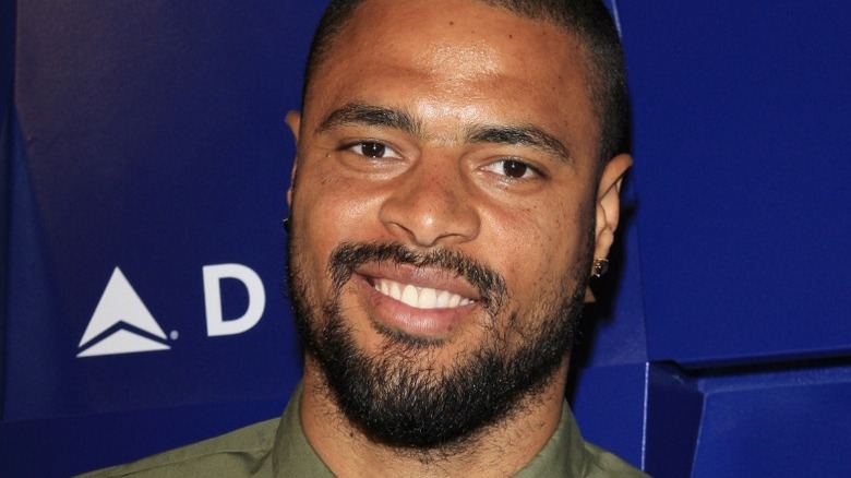 Tyson Chandler in front of a blue Delta backdrop