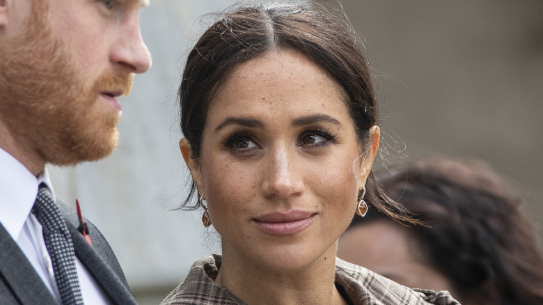 Meghan Markle slightly smiling
