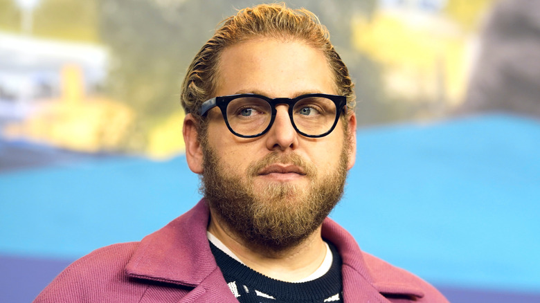 Jonah Hill posing and looking to the side
