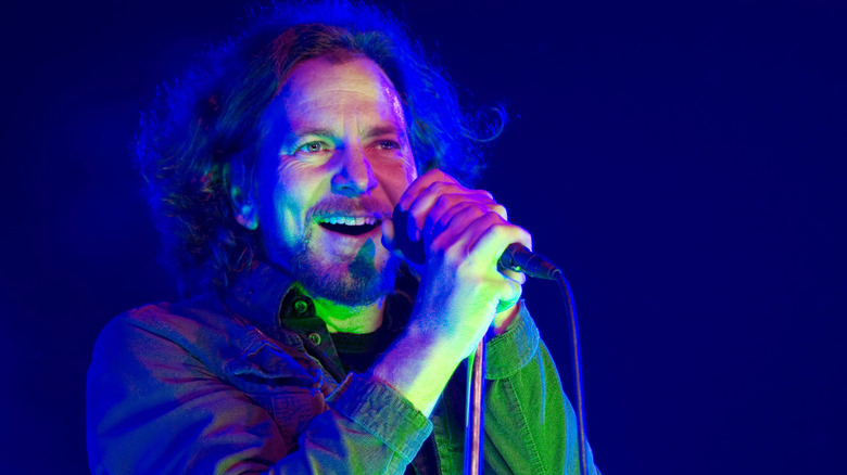 Eddie Vedder holding a microphone