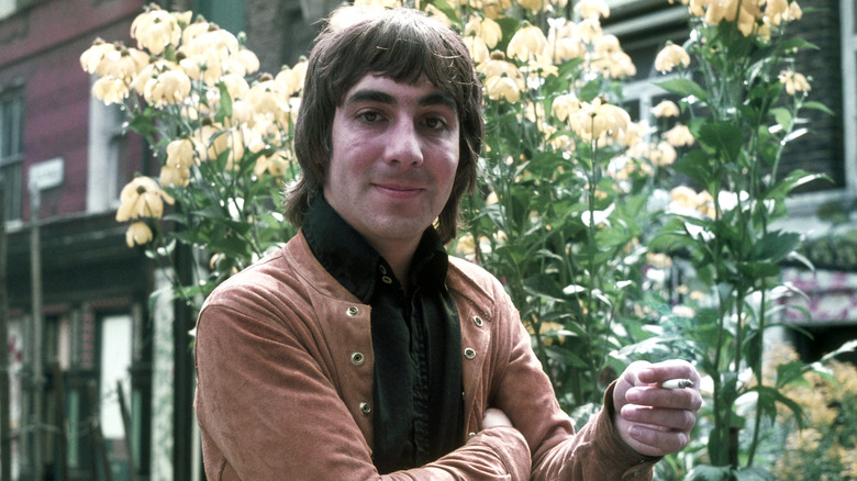 Keith Moon in front of flowers