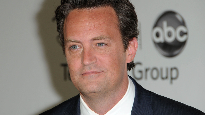 Matthew Perry smiling at event