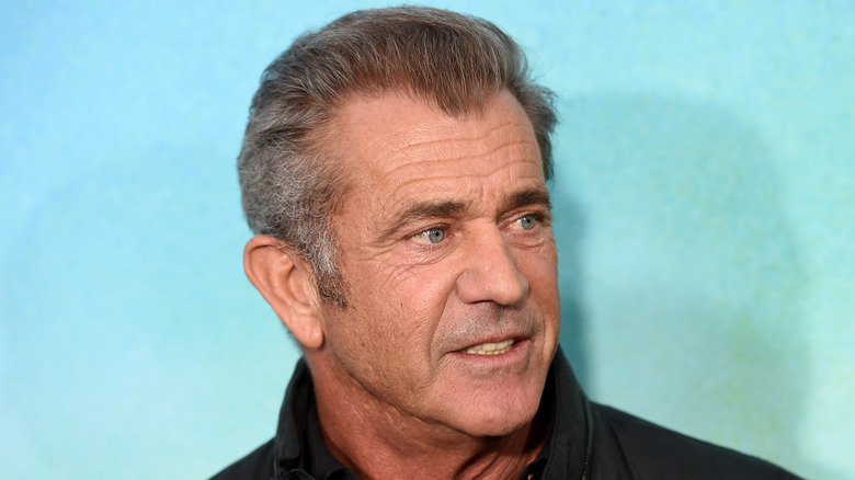 Mel Gibson smiling and looking to the right
