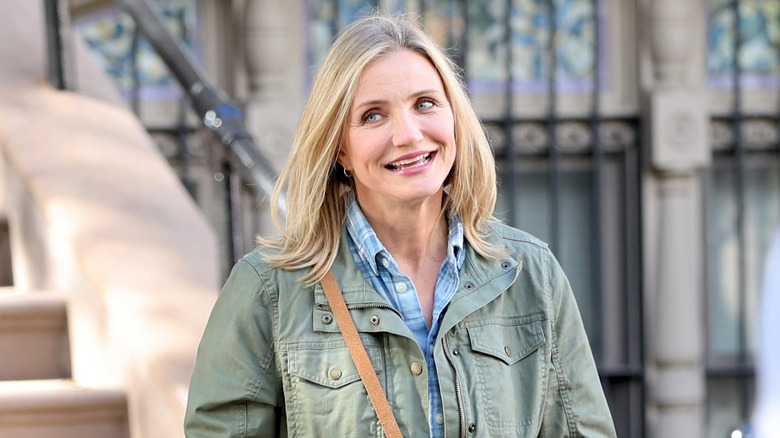 Cameron Diaz smiling and walking outside