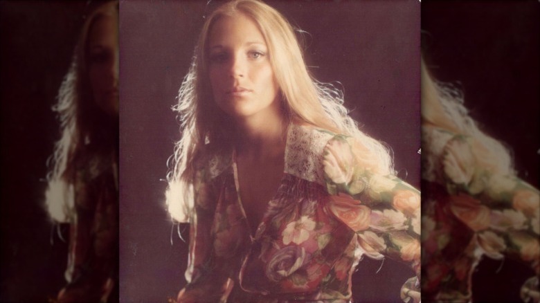 Jill Biden poses in a floral dress in the '70s