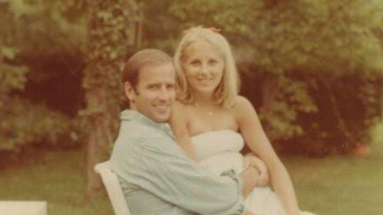 Young Jill Biden sitting in Joe Biden's lap