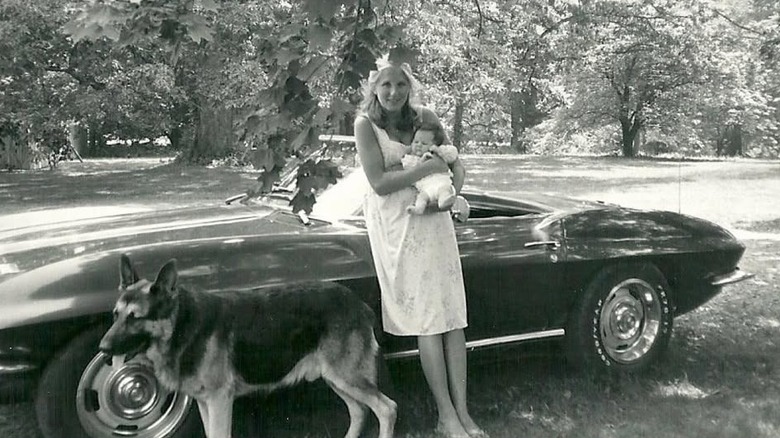 Jill Biden holds Ashley Biden as a newborn in front of a car