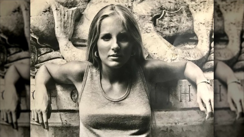 Jill Biden poses in front of statue