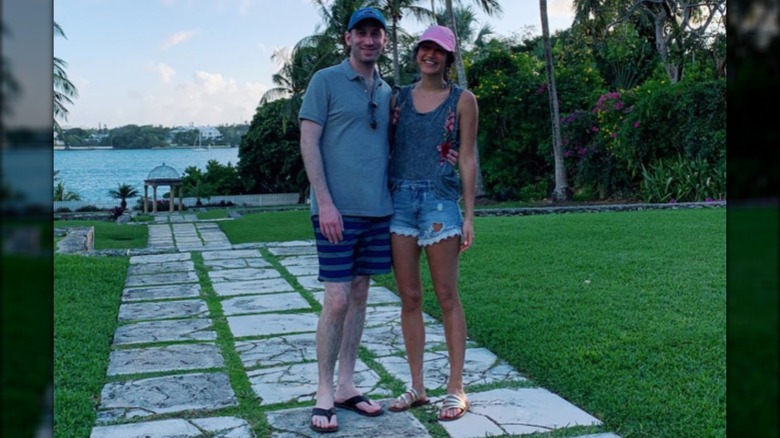 Stephen and Katie Miller posing together on their honeymoon.