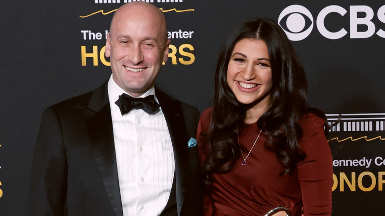 Stephen and Katie Miller pose together on the red carpet.