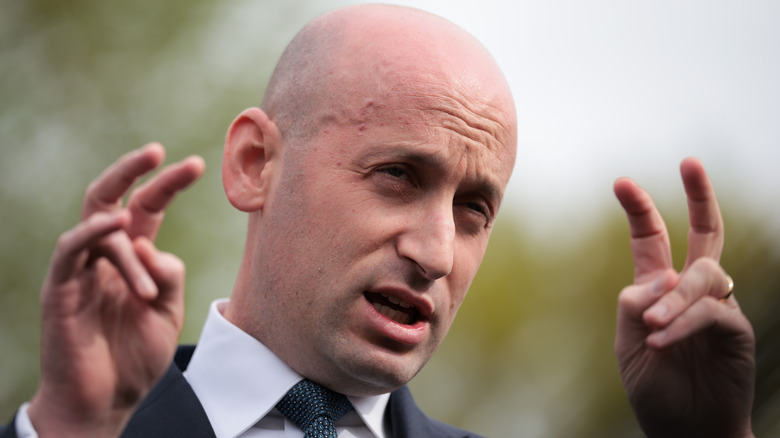 Stephen Miller flashing air quotes