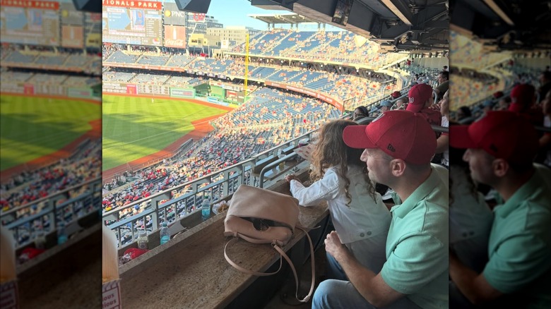Stephen Miller watching a Washington Nationals baseball game with his young daughter