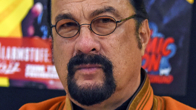 Steven Seagal goatee round glasses