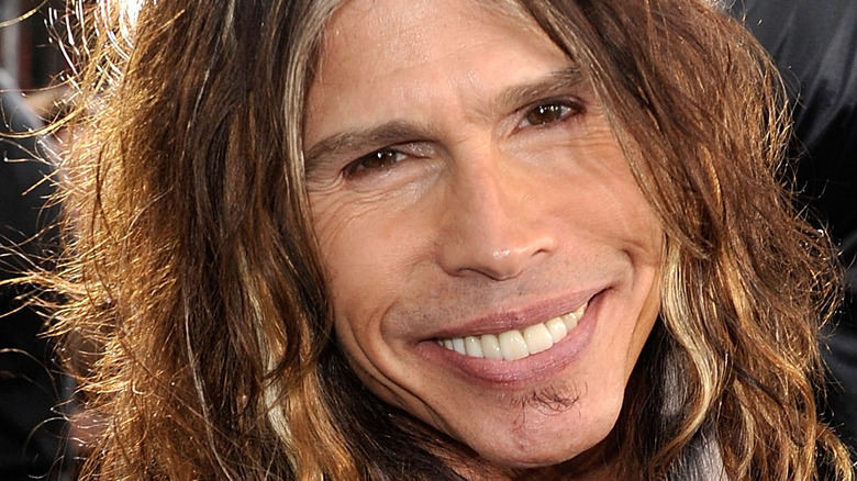 Steven Tyler smiling with soul patch 