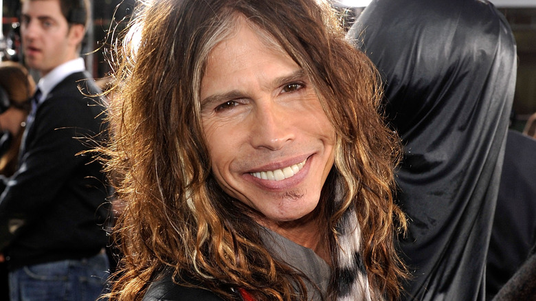 Steven Tyler smiling with soul patch