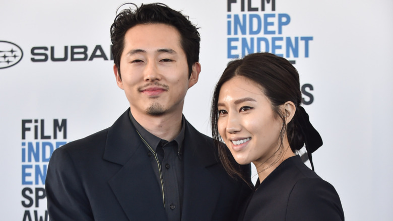 Steven Yeun posing with wife Joana Pak