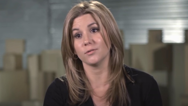 Brandi Passante in front of storage boxes