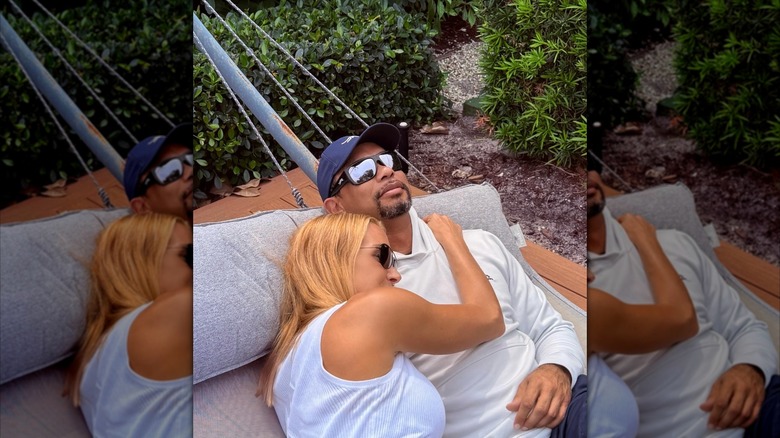 Vanessa cuddling with Tiger in hammock