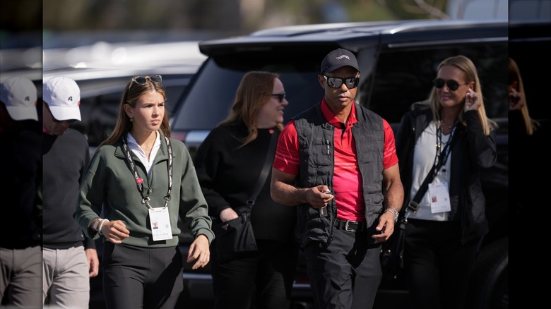 Tiger with Vanessa and daughter Kai at golf tournament