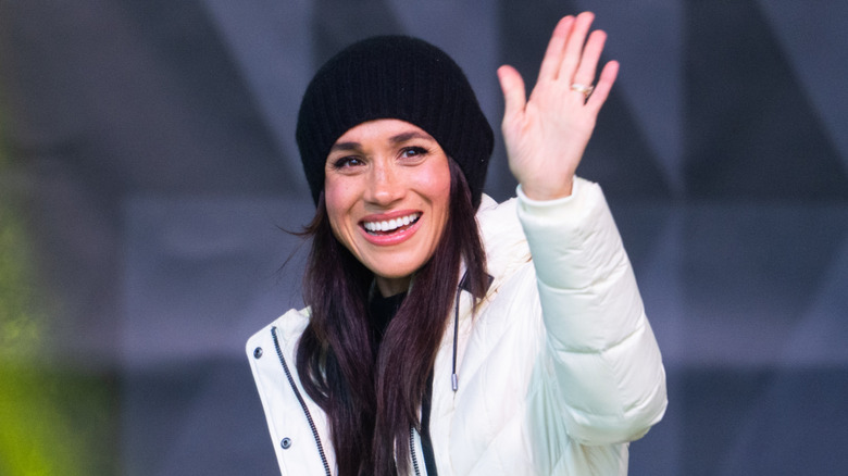 Meghan Markle wearing a winter jacket and beanie
