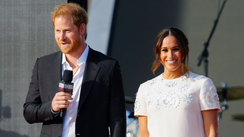 Meghan Markle and Prince Harry posing, both smiling