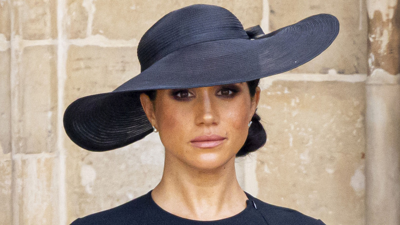 Meghan Markle, posing at Queen Elizabeth's funeral