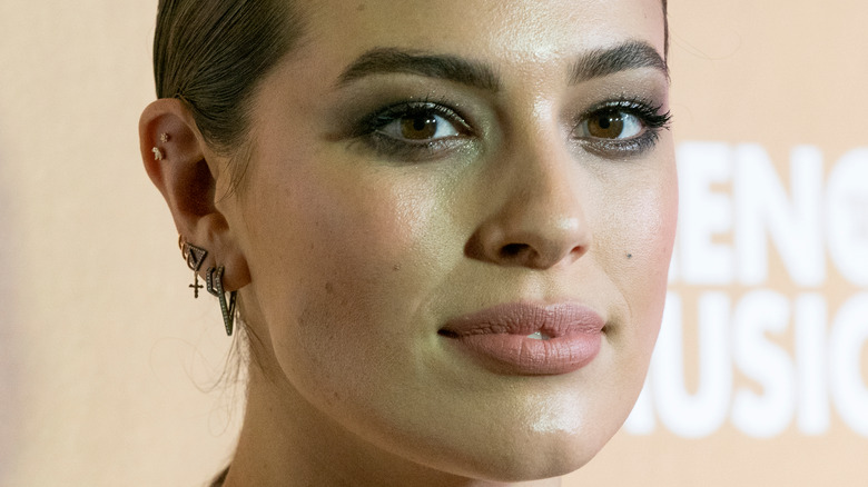 Ashley Graham with a neutral expression
