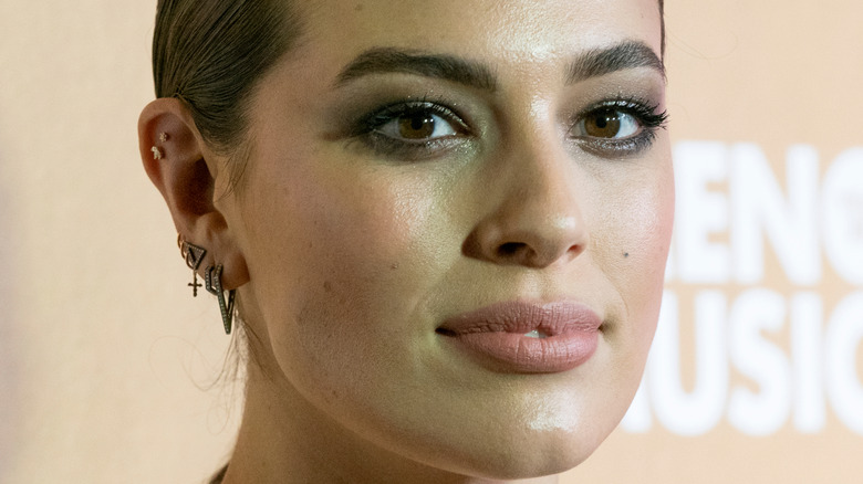 Ashley Graham with a neutral expression