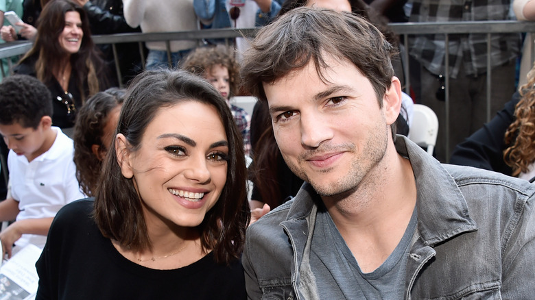 Mila Kunis and Ashton Kutcher smiling