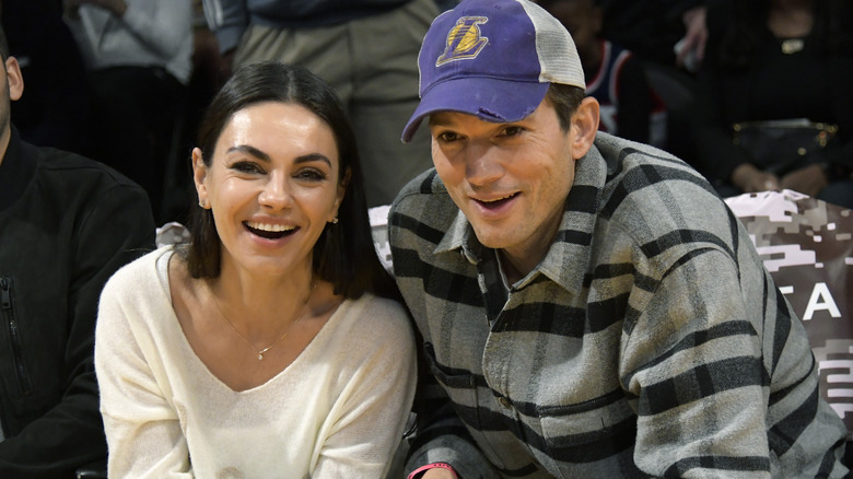 Mila Kunis and Ashton Kutcher laughing
