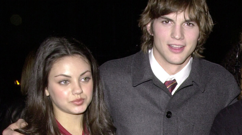 Mila Kunis looking awkward with Ashton Kutcher
