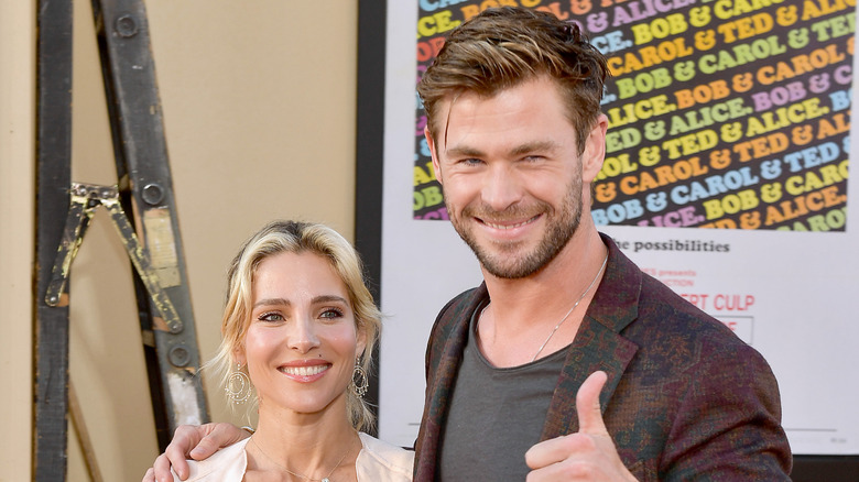 Elsa Pataky and Chris Hemsworth giving thumbs up