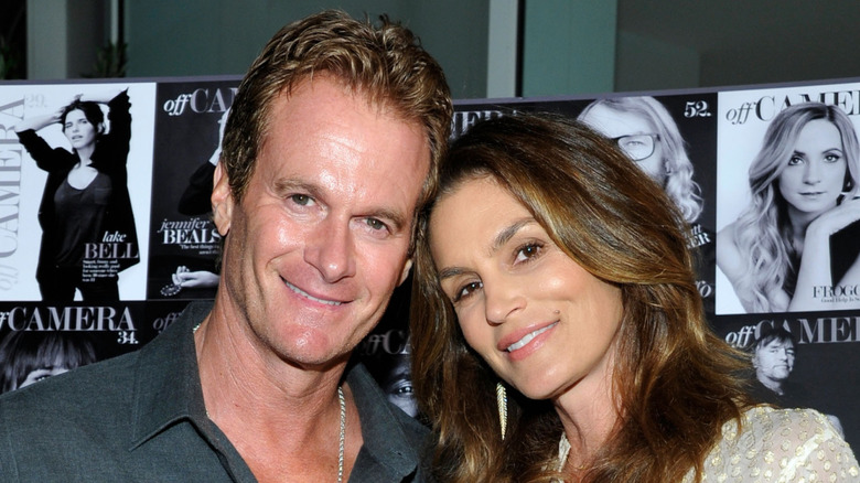 Rande Gerber and Cindy Crawford smiling and posing together