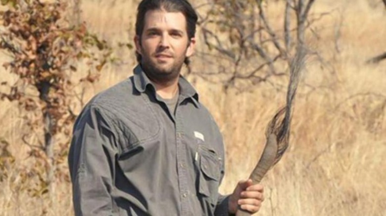 Donald Trump Jr. poses with an elephant tail