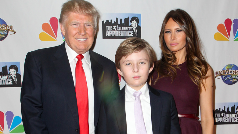 Donald, Barron, and Melania Trump smiling