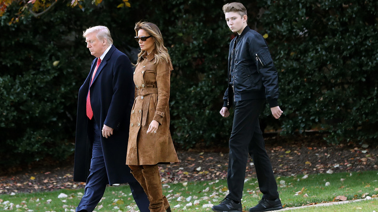 Donald, Melania, and Barron Trump walking