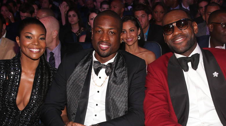 Dwyane Wade, Gabrielle Union, and LeBron James sit together