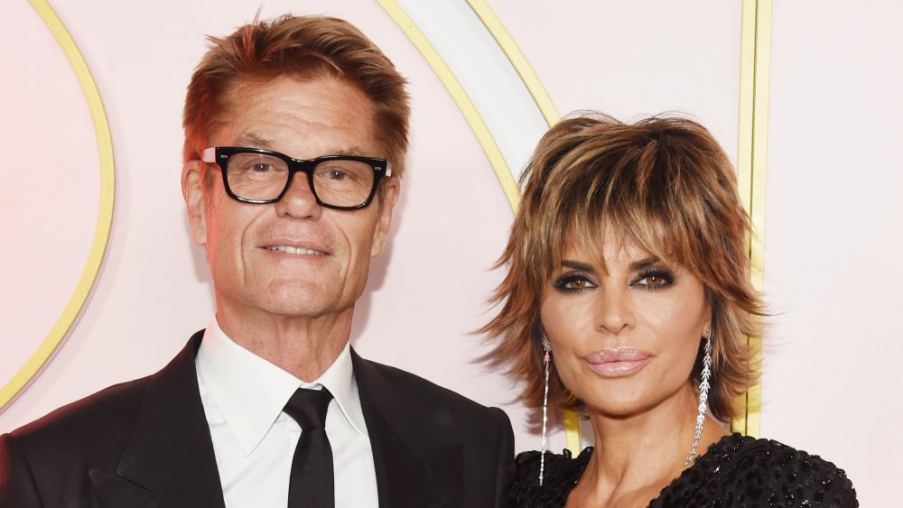 Harry Hamlin and Lisa Rinna, both wearing black, posing at a 2018 Emmys after party 