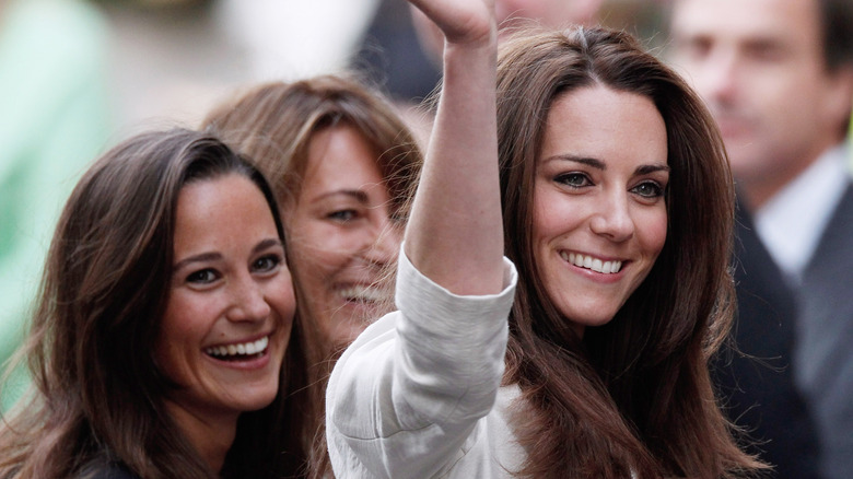 Pippa Middleton laughing, Kate Middleton waving