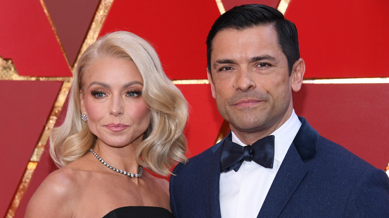 Kelly Ripa and Mark Consuelos posing