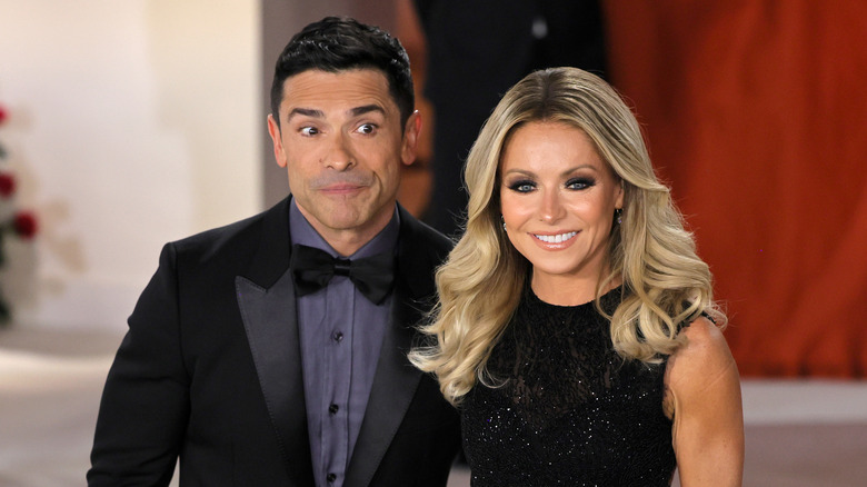 Kelly Ripa and Mark Consuelos posing