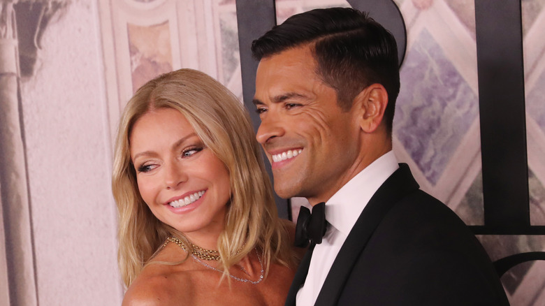 Kelly Ripa and Mark Consuelos grinning