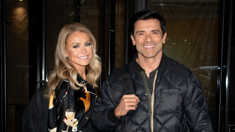 Kelly Ripa and Mark Consuelos posing