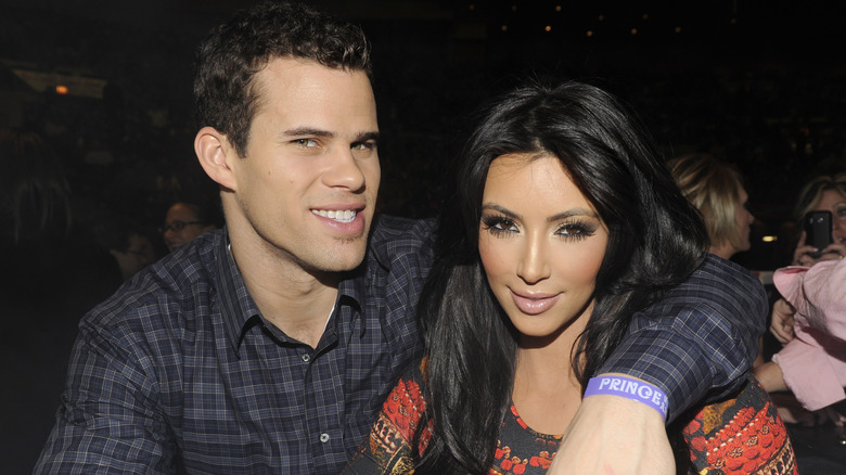 Kim Kardashian posing with Kris Humphries