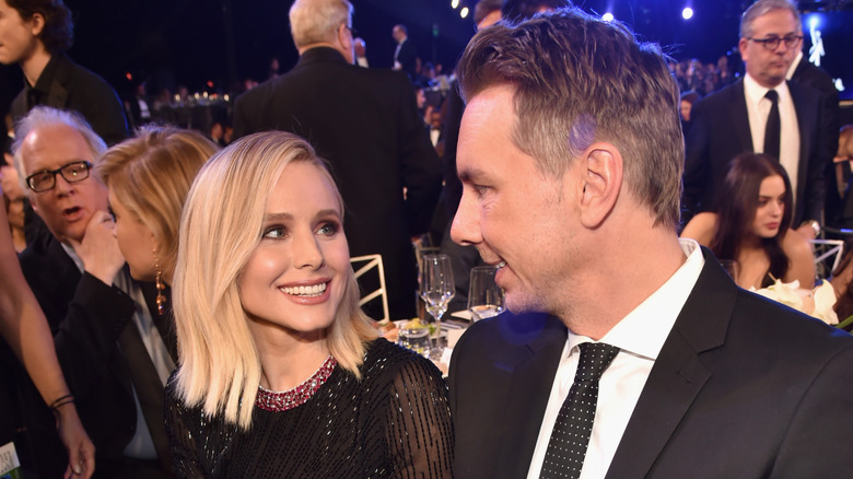 Kristen Bell and Dax Shepard looking at one another