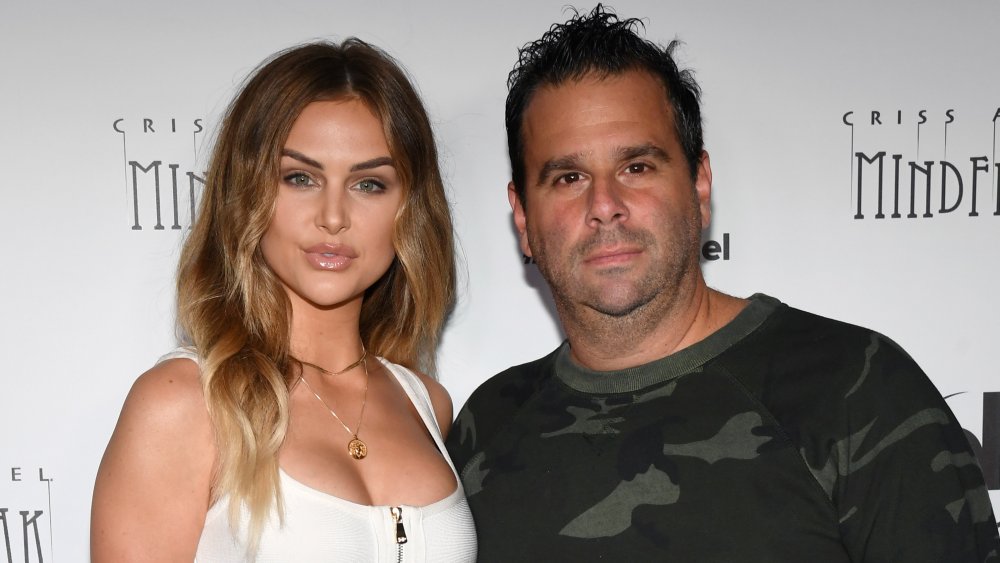 Lala Kent in a white crop top, Randall Emmett in a camo sweatshirt