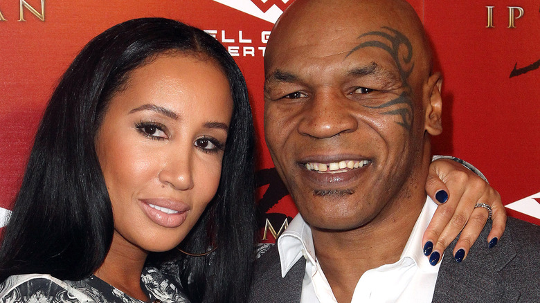 Lakiha Spicer and Mike Tyson pose