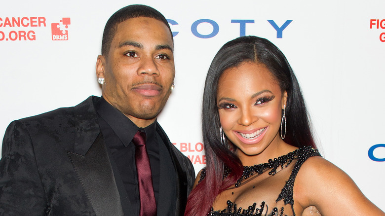 Nelly and Ashanti posing together